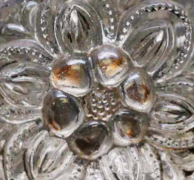 Detail of early floral sandwich glass dresser knob