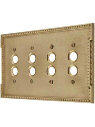 Neoclassical Quad Gang Push Button Switch Plate in Polished Brass