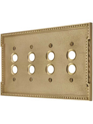 Neoclassical Quad Gang Push Button Switch Plate in Polished Brass