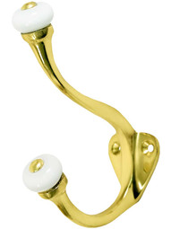 Double Coat Hook with Porcelain Ball Tips In Lacquered Brass