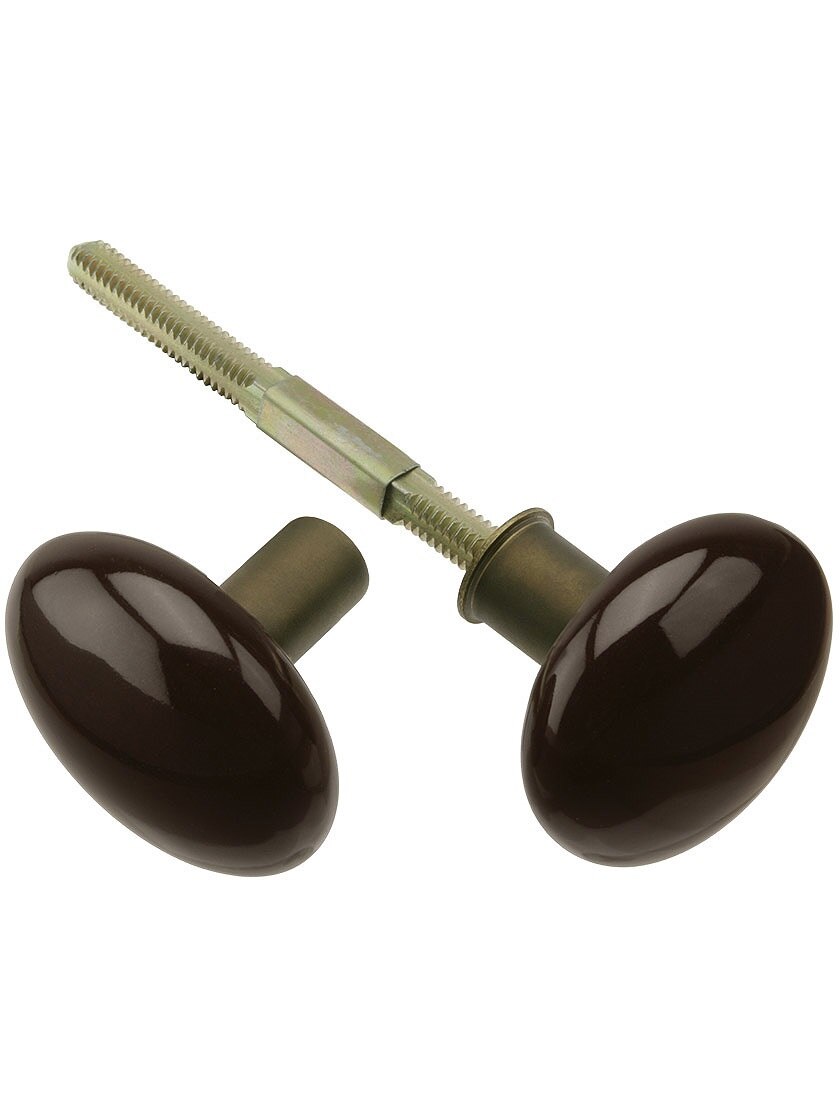Pair of Brown Porcelain Rim Lock Knobs With Solid Brass Shanks in