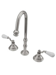 Shasta Widespread Bathroom Faucet with White Porcelain Levers in Polished Nickel
