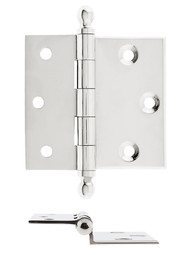 Pair of 2 1/2" Half Surface Cabinet Hinges With Beveled Leaves In Polished Nickel