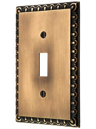 Ovolo Single Toggle Switch Plate in Antique-By-Hand.