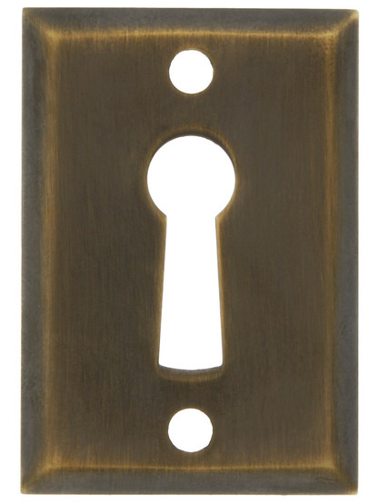 Rectangular Stamped Brass Keyhole Cover in Antique-By-Hand - 1 11/16 x 1 3/16 inch.