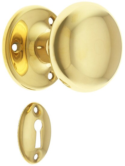 Solid Brass Rosette Mortise Lock Set with Round Brass Knobs in Unlacquered Brass.