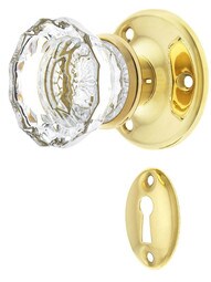 Solid Brass Rosette Mortise Lock Set with Fluted Glass Knobs in Unlacquered Brass.