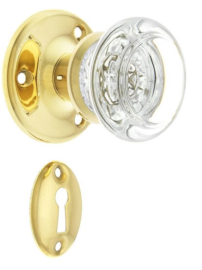 Solid Brass Rosette Mortise Lock Set with Round Glass Knobs in Unlacquered Brass.