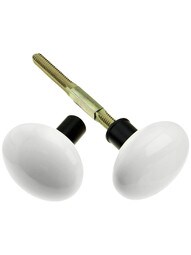 Pair of White Porcelain Rim Lock Knobs With Black Iron Shanks.