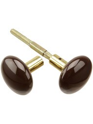 Pair of Brown Porcelain Doorknobs with Brass Shanks.