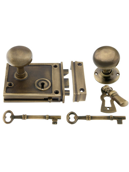 Solid Brass Horizontal Rim Lock Set with Small Round Knobs In Antique-By-Hand Finish.