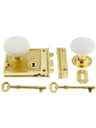 Solid Brass Horizontal Rim Lock Set with White Porcelain Knobs.