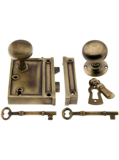 Solid Brass Vertical Rim Lock Set with Small Round Knobs In Antique-By-Hand Finish.