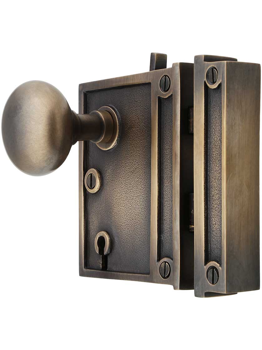 Alternate View of Solid Brass Vertical Rim Lock Set with Small Round Knobs In Antique-By-Hand Finish.
