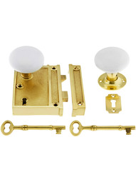 Solid Brass Vertical Rim Lock Set with White Porcelain Knobs.
