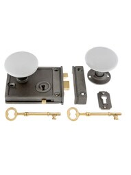 Cast Iron Horizontal Rim Lock Set with White Porcelain Door Knobs.