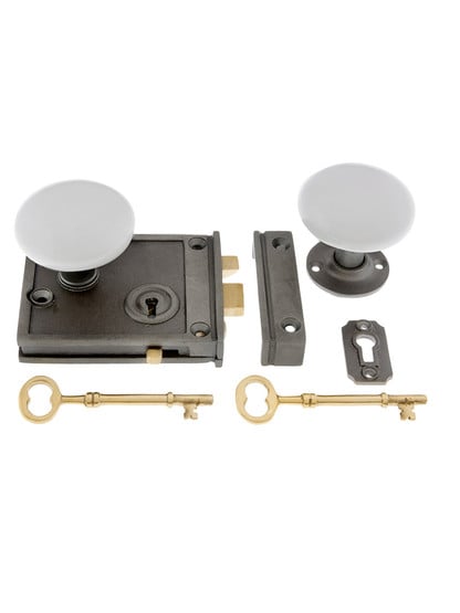 Cast Iron Horizontal Rim Lock Set with White Porcelain Door Knobs.