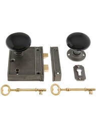 Cast Iron Vertical Rim Lock Set with Black Porcelain Door Knobs.