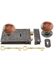 Cast Iron Scroll Rim Lock Set with Brown Swirl Porcelain Knobs in