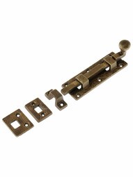 Cast Bronze Door Bolt With Curled Handle in Weathered Bronze