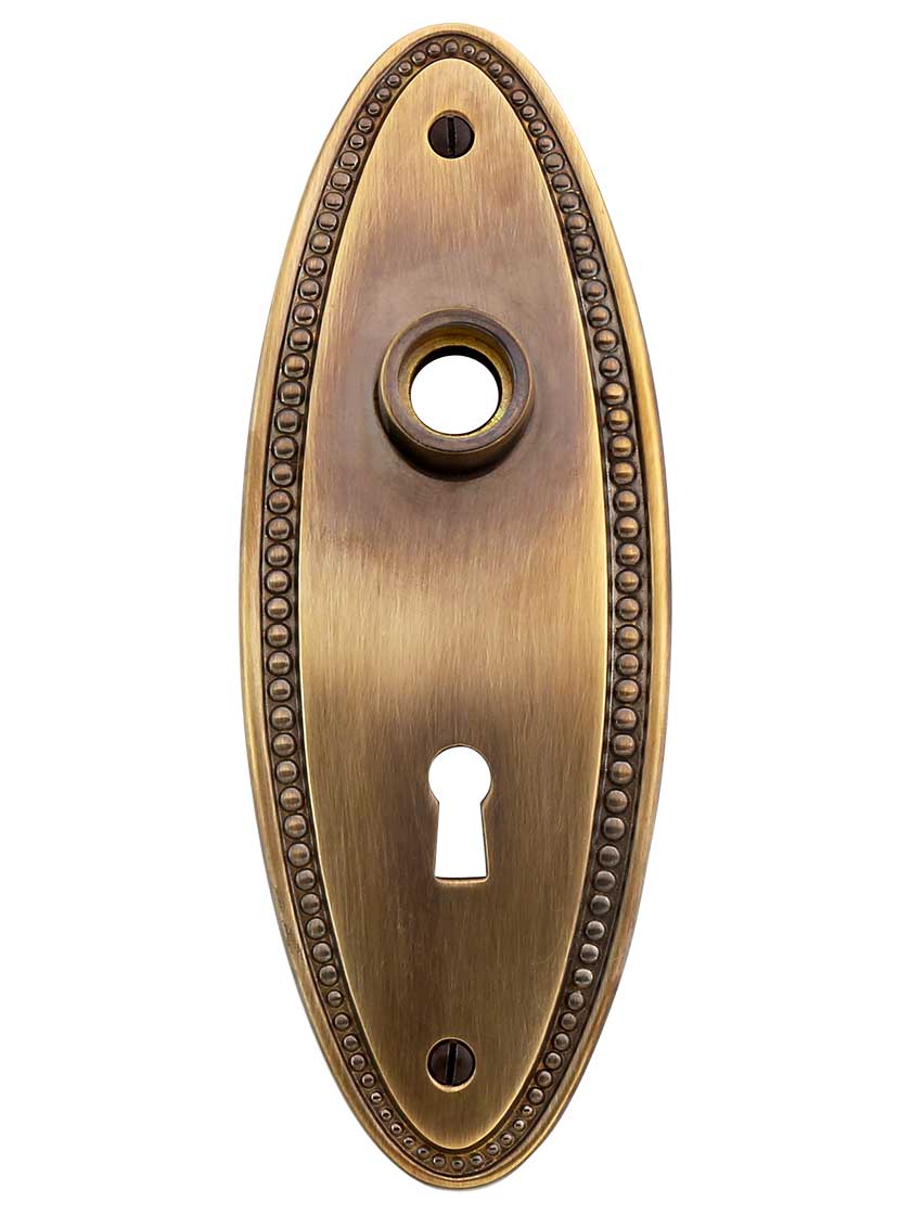 Solid-Brass Beaded Oval Door Plate with Keyhole in Antique-By-Hand