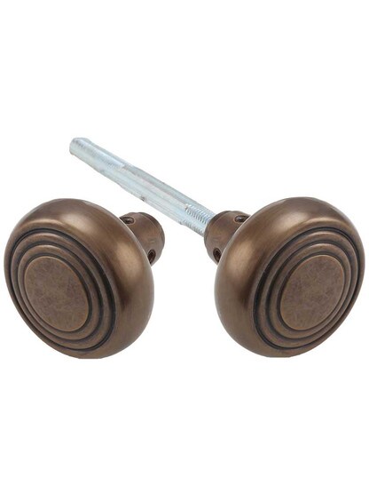 Pair of Streamline Deco Door Knobs in Antique-by-Hand.