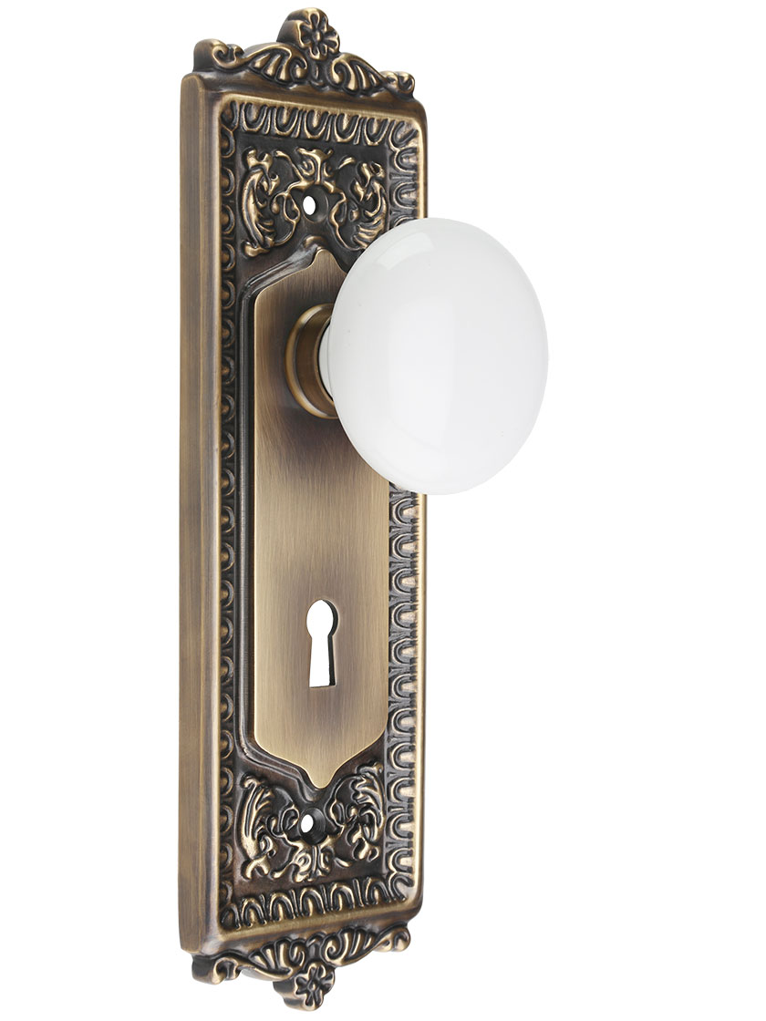 Egg & Dart Design Mortise-Lock Set with White Porcelain Knobs in Antique-By-Hand