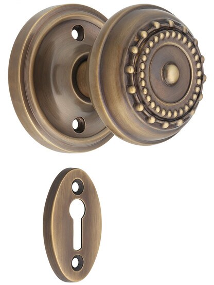 Classic Rosette Mortise-Lock Set with Meadows Design Knobs in Antique-By-Hand.