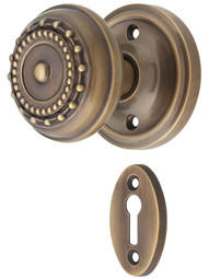 Classic Rosette Mortise-Lock Set with Meadows Design Knobs in Antique-By-Hand.