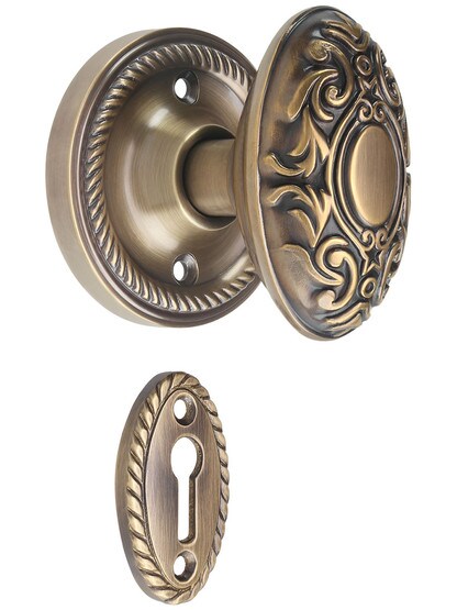 Rope Rosette Mortise Lock Set with Decorative Oval Knobs in Antique-By-Hand.
