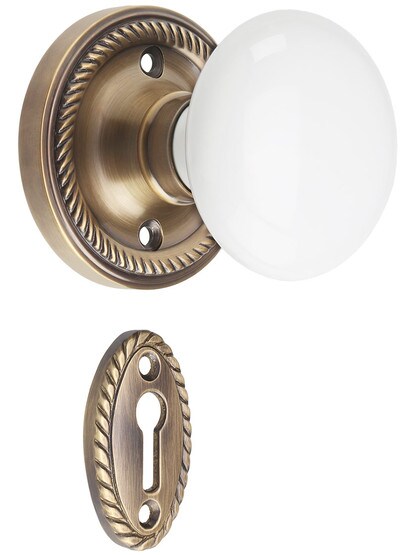 Rope Rosette Mortise-Lock Set with White Porcelain Knobs in Antique-By-Hand.