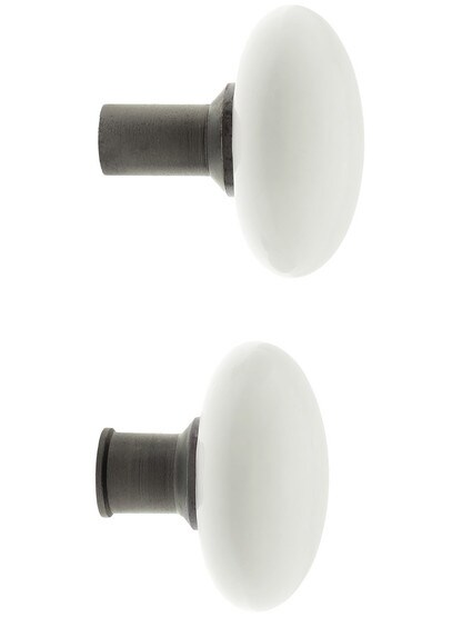 Alternate View 3 of Pair of White Porcelain Rim Lock Knobs With Solid Iron Shanks In Antique Iron.