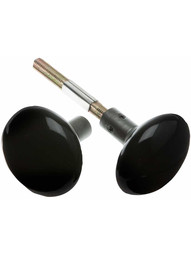 Pair of Black Porcelain Doorknobs with Iron Shanks in Antique Iron.