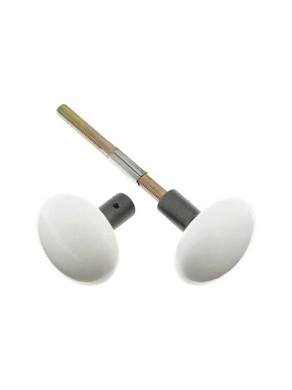 Pair of White Porcelain Doorknobs with Iron Shanks in Antique Iron.