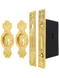 Oriental Bit-Key Single Pocket Door Mortise-Lock Set in Unlacquered Brass.