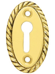 Oval Vertical Rope-Pattern Brass Keyhole Cover - 1 7/8 x 1 1/8"