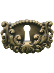 Decorative Stamped Brass Keyhole Cover in Antique-By-Hand Finish.