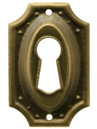 Stamped Brass Colonial Revival Keyhole Cover in Antique-By-Hand Finish