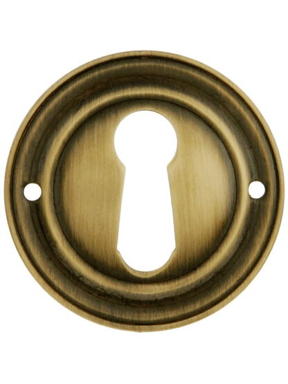 Round Stamped Brass Keyhole Cover in Antique-By-Hand Finish.