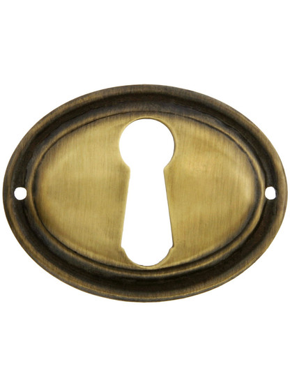 Horizontal Oval Stamped-Brass Keyhole Cover in Antique-By-Hand