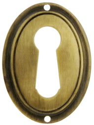 Vertical Oval Stamped-Brass Keyhole Cover in Antique-By-Hand