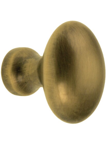 Small Oval Brass Cabinet Knob in Antique-By-Hand - 1 inch x 5/8 inch