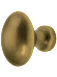 Small Oval Brass Cabinet Knob in Antique-By-Hand - 1 inch x 5/8 inch