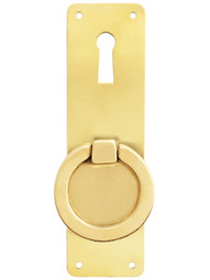 Mission-Style Vertical Cabinet Ring Pull in Unlacquered Brass.