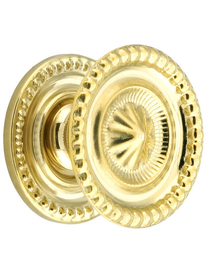 Medium Federal Style Knob and Backplate - 1 1/4 inch Diameter in Unlacquered Brass.