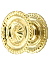 Medium Federal Style Knob and Backplate - 1 1/4 inch Diameter in Unlacquered Brass.