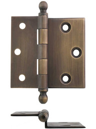 Pair of 2 1/2 inch Half-Surface Cabinet Hinges With Beveled Leaves in Antique-by-Hand.