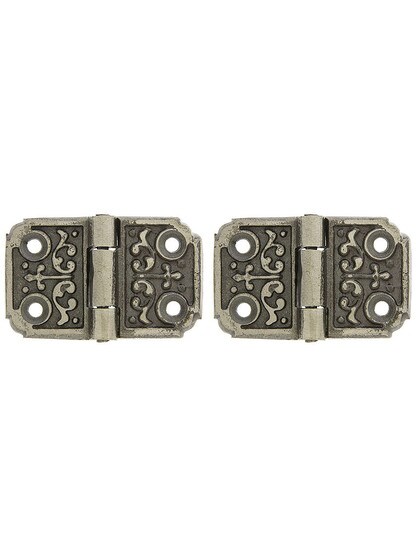 Pair of Small Decorative Cast Iron Cabinet Hinges - 1 1/4 inch H x 2 1/8 inch W.