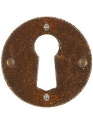 Steel Cabinet Keyhole Cover In Distressed Rust Finish.