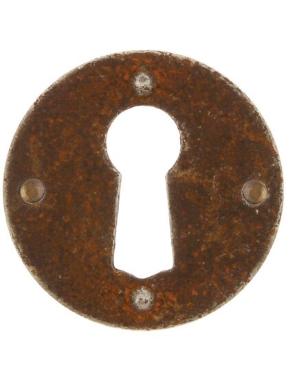 Steel Cabinet Keyhole Cover In Distressed Rust Finish.